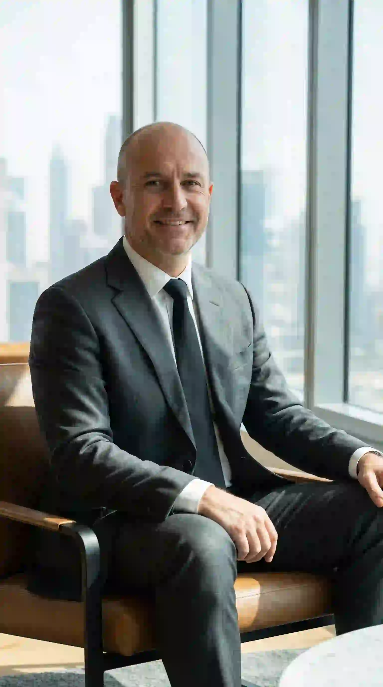 A man deciding to shave his sparse beard, realizing that a clean shave is sometimes the best answer to how to remove patchy beard.