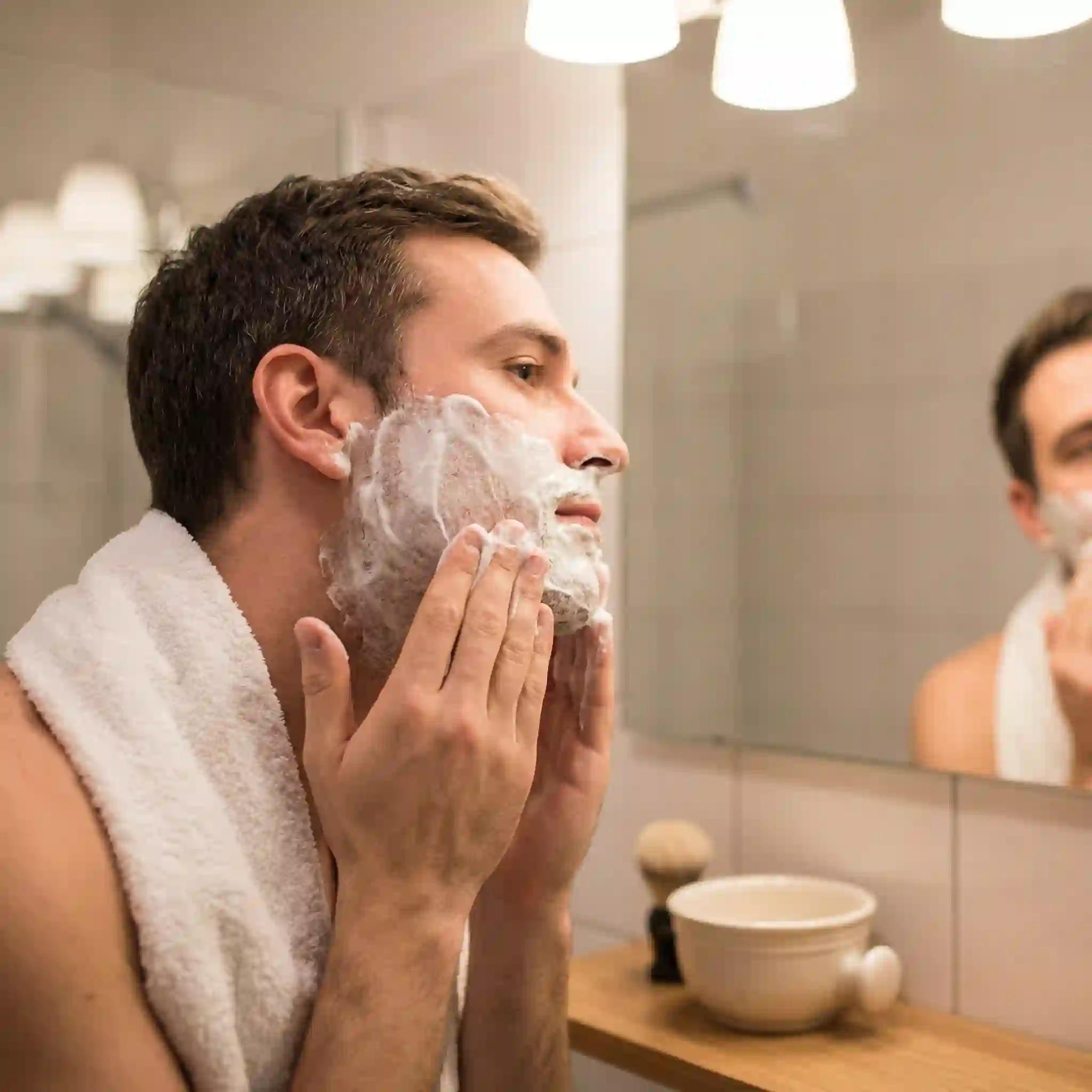 Shaving cream applied for a clean shaven pass, creating a slick protective layer that reduces friction, cuts, and post shave redness.