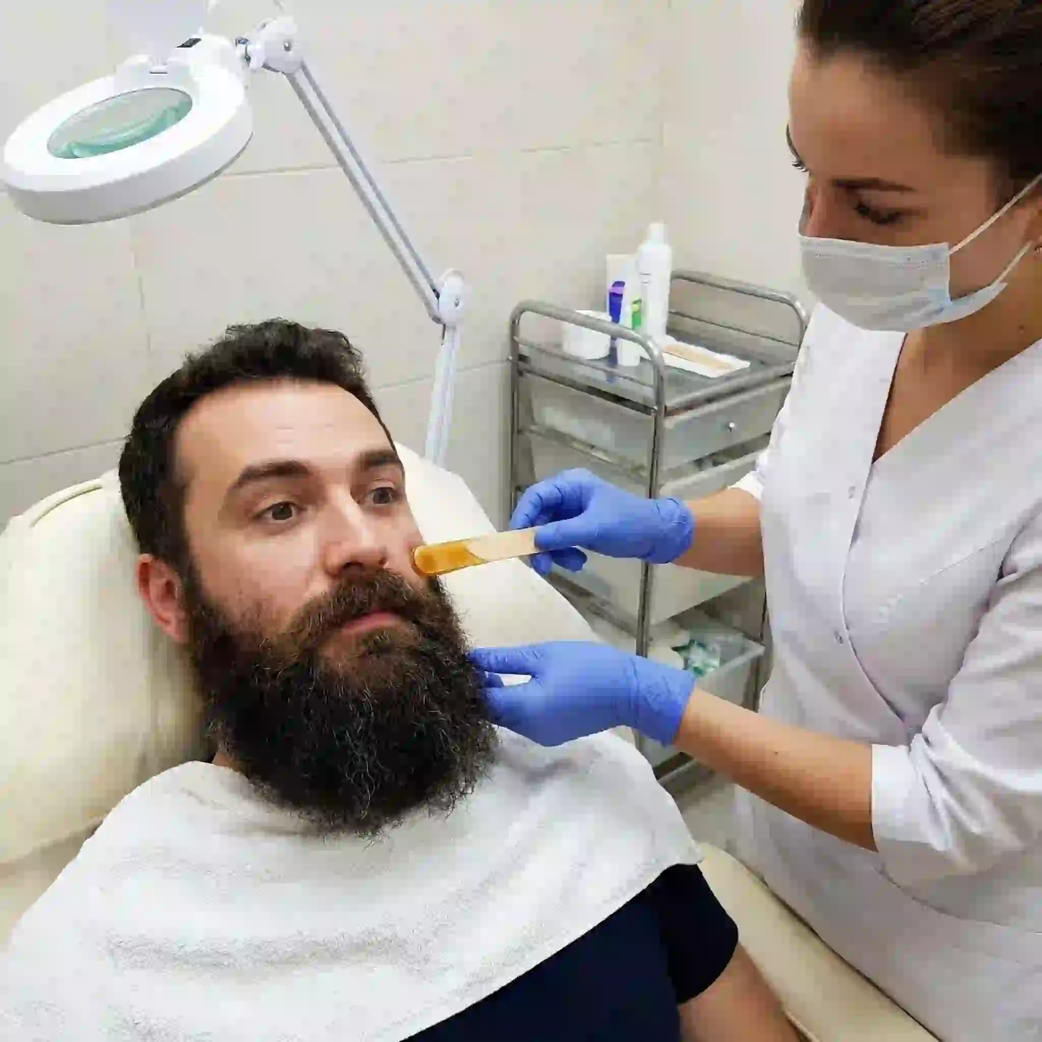 Coarse thick beard removal using professional waxing and IPL laser treatments for long-lasting smooth skin results