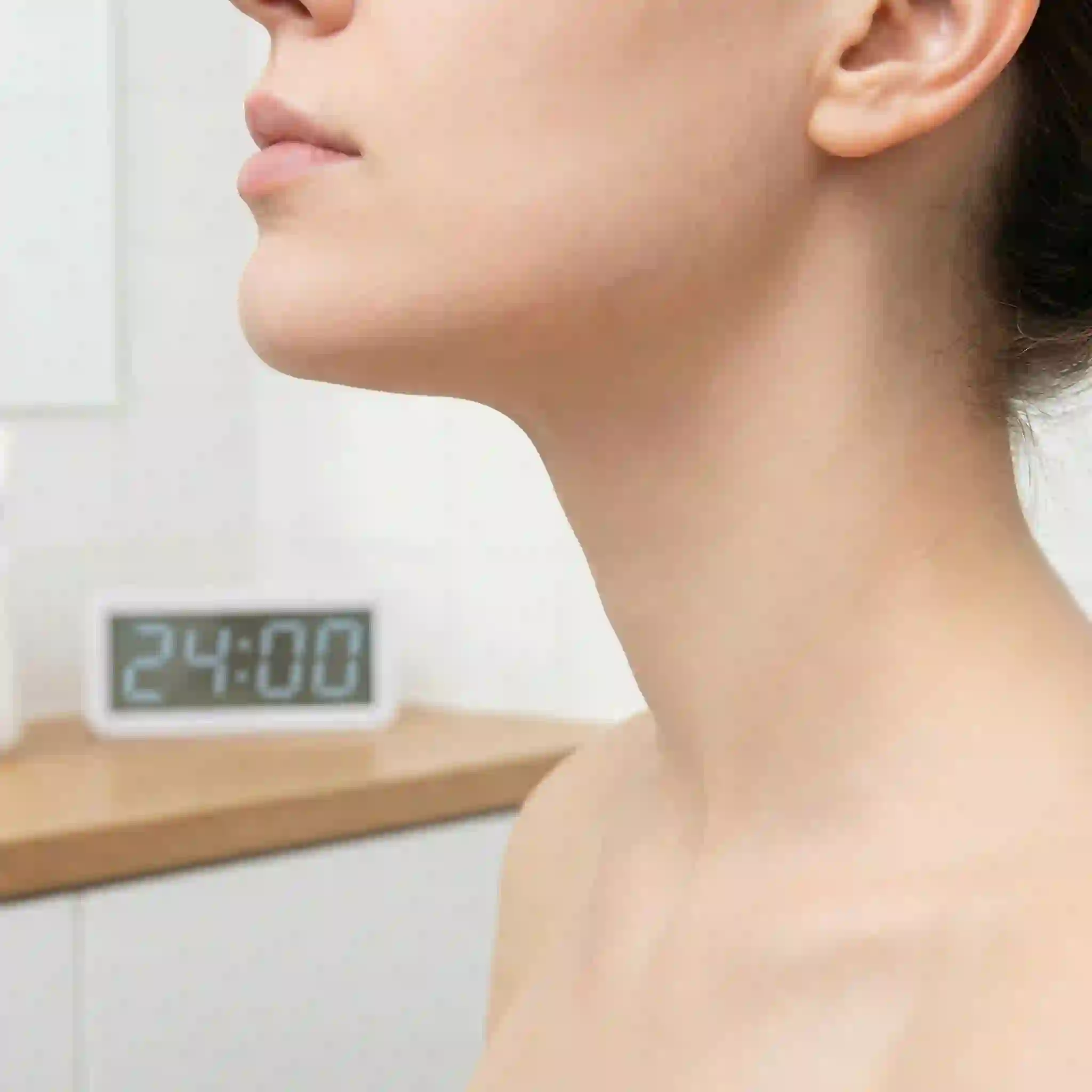 Removing women's facial hair cream after timed application showing gentle spatula removal and cool water rinse step