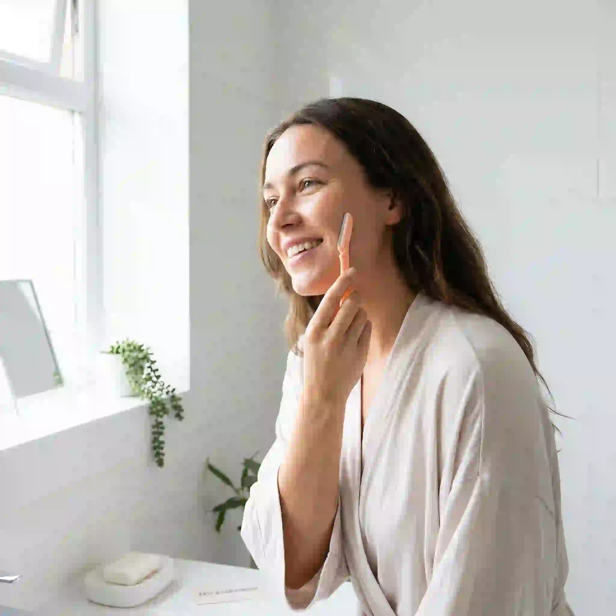 Women shaving facial hair using sharp clean razor with lubricating cream for quick smooth peach fuzz removal