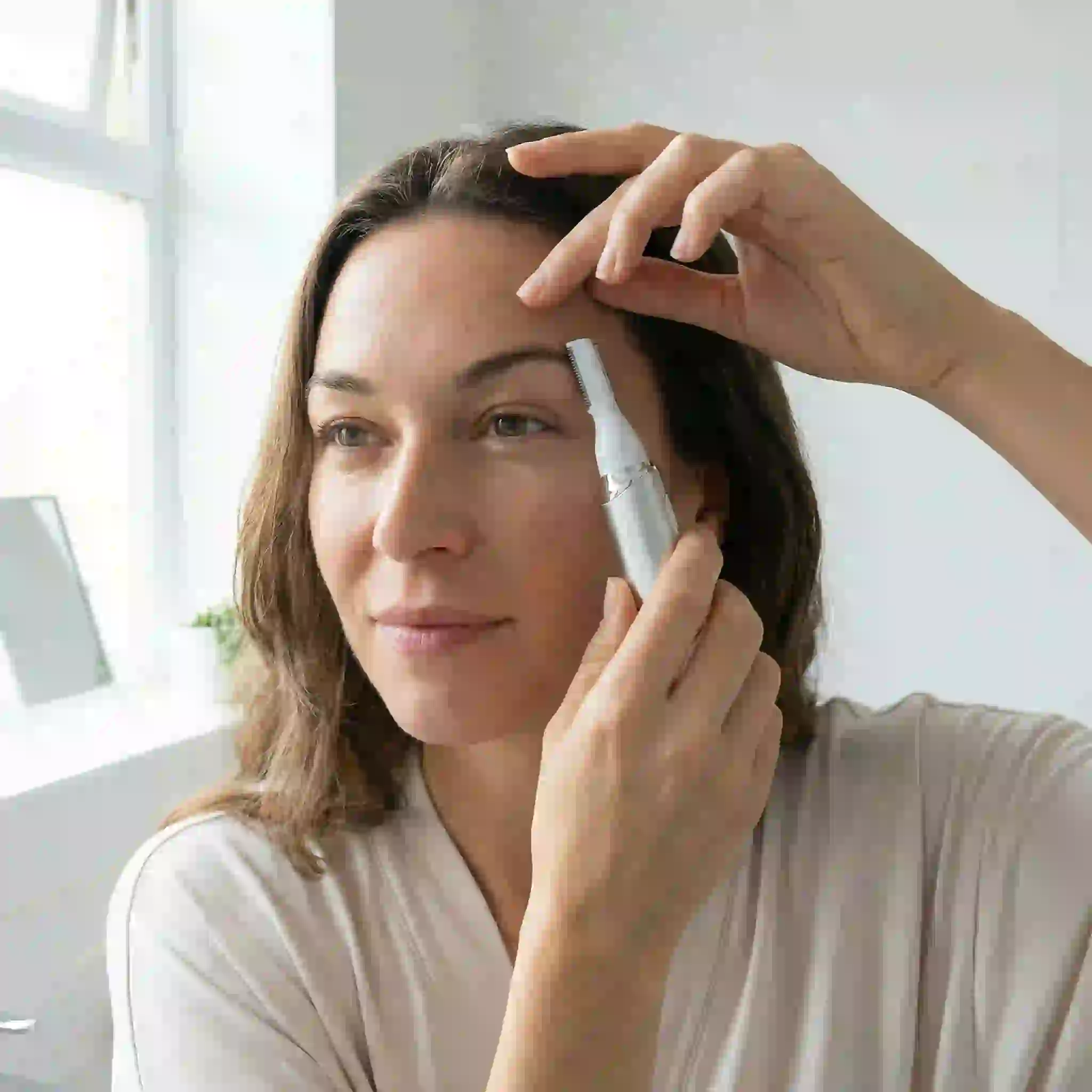 Best face trimmer for women showing precision compact device for eyebrow shaping and upper lip hair removal